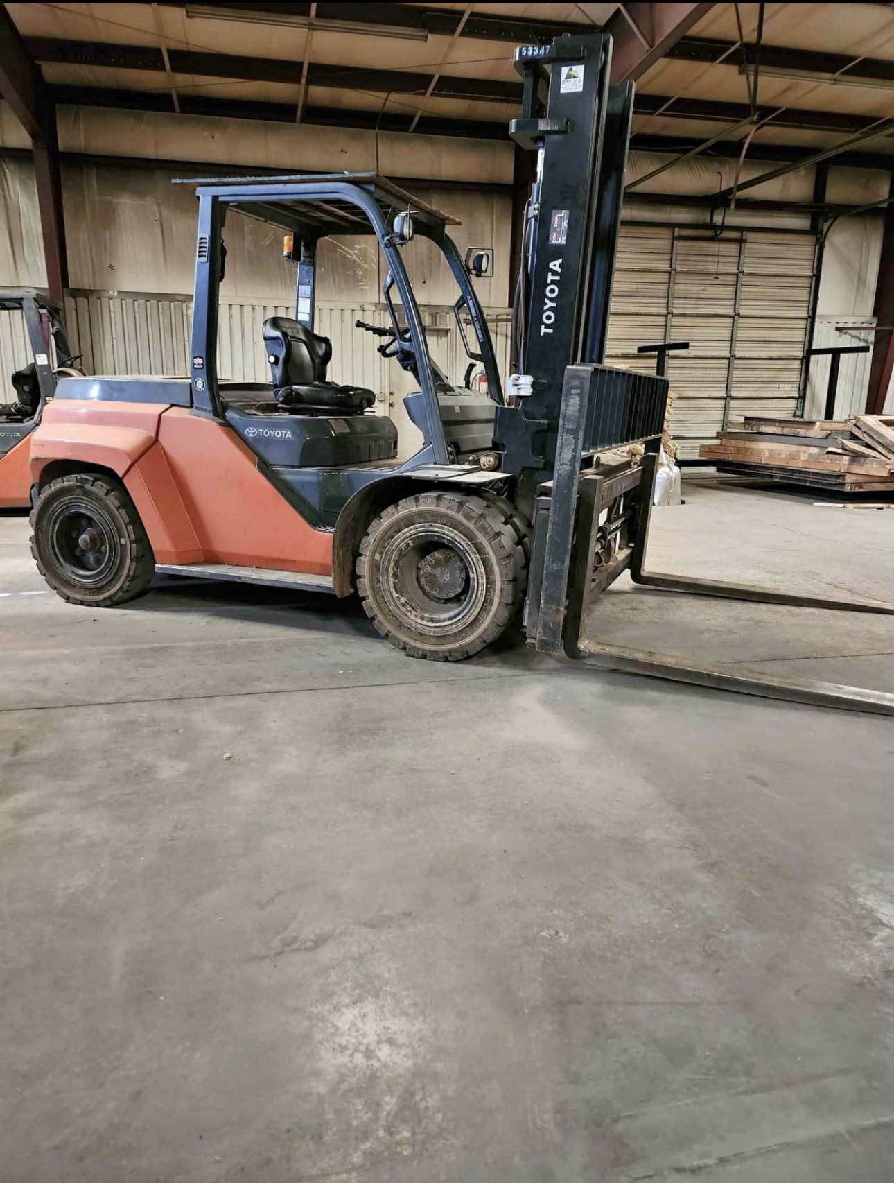 Large Toyota warehouse forklift that may be excess, oversized, or being replaced