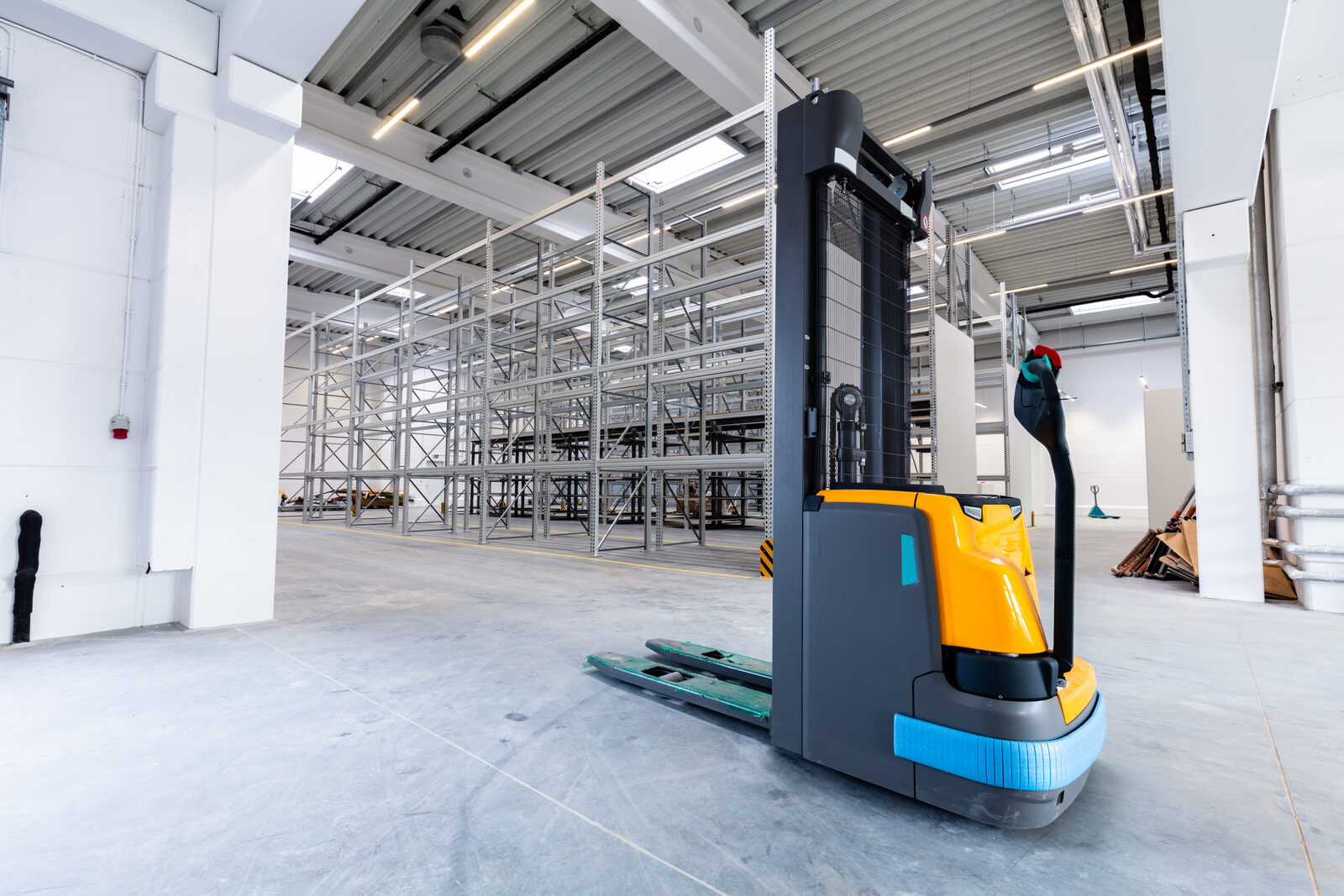 Electric pallet jack in a newer warehouse environment ready for continued use or resale